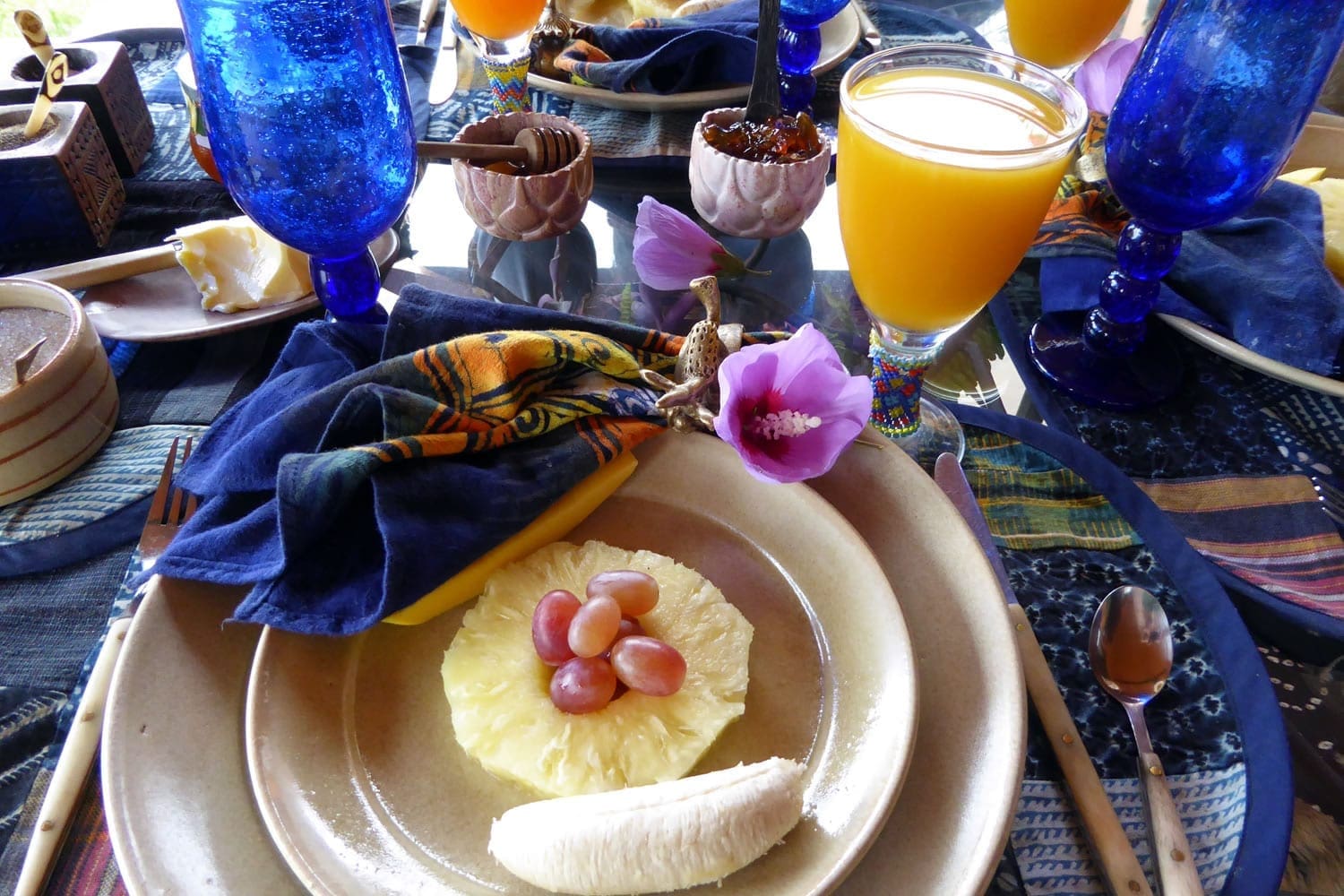 Breakfast table with Purple Hibiscus on one of the African Heritage House verandahs.